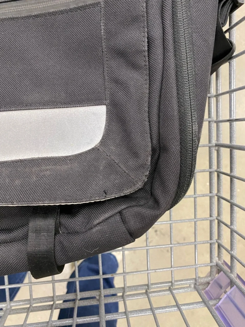 Patagonia 'Critical mass' messenger bag in black - AVEDA logo embroidered